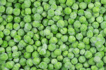 Frozen green peas texture background. ice peas background for food textures. Raw vegetables.
