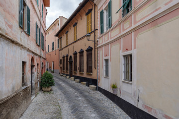 Fototapeta na wymiar Typical Italian narrow street, Diano Castello ancient village, Province of Imperia, Italy