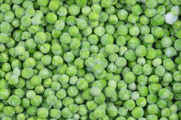 Frozen green peas texture background. ice peas background for food textures. Raw vegetables.