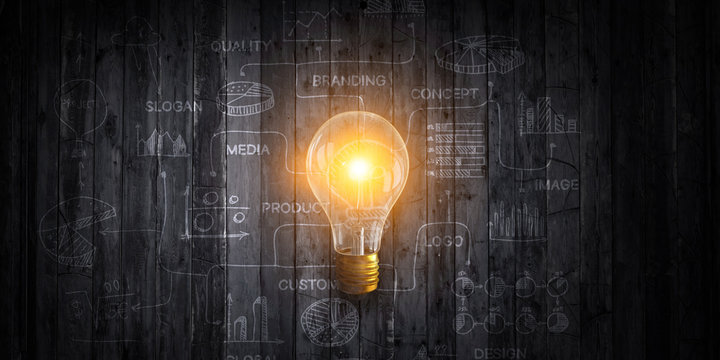 Light bulb image as symbol of innovation . Mixed media