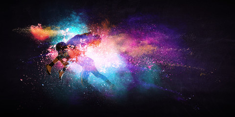 Boys playing soccer hitting the ball