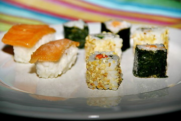 different variations of sushi, japanese food, seafood and rice, served on a plate,