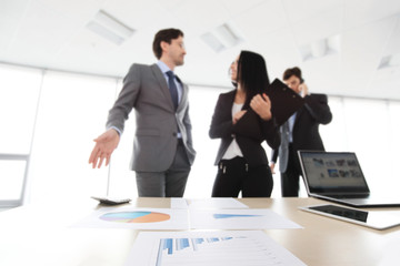 Business people discuss reports