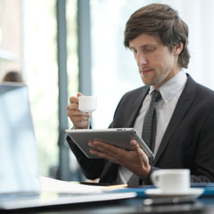 Fototapeta na wymiar Business man with tablet computer