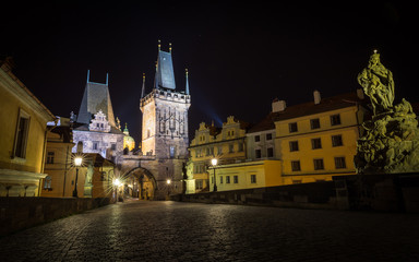 Fototapeta premium Old Prague, Czech Republic, Bohemia, Castles and Charles Bridge at night without people.