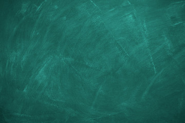 Abstract texture of chalk rubbed out on blackboard or chalkboard background. School education, dark wall backdrop or learning concept.