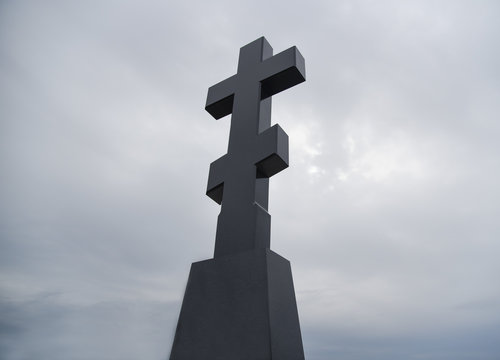 Orthodox cross against a gloomy sky