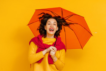 woman with umbrella on color background