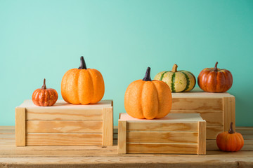 Autumn season concept with pumpkin decor on wooden table. Halloween or Thanksgiving greeting card.