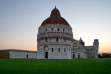 View of the Baptistery and Cathedral with the Leaning Tower of Pisa in Piazza dei Miracoli of Pisa, region of Tuscany