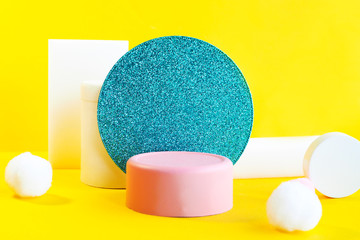 minimalistic scene pink podium and geometric shapes circles and rectangles on a yellow background.