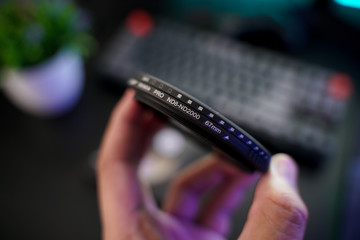 A man hand holding a variable ND (Nuetral Density) filter