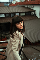 Beautiful young girl posing on the streets of the European city.