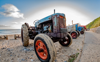 Close up and fisheye view of tractor on Cromer beach on the North Norfolk coast