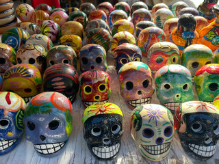 Day of the Dead in Mexico. Beautiful bright masks in the handmade market.Festive traditions in Mexico.Horizontal, close-up, nobody.