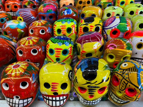 Day of the Dead in Mexico. Beautiful bright masks in the handmade market.Festive traditions in Mexico.Horizontal, close-up, nobody.