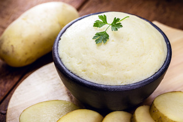 Brazilian mashed potato, on rustic background on wooden table. Organic product.