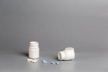 White plastic bottles of medicine and pills