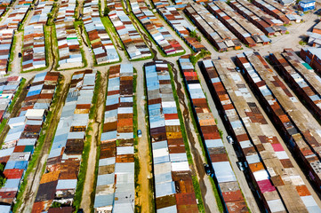 ramshackle shacks in a poor area taken from above by a drone