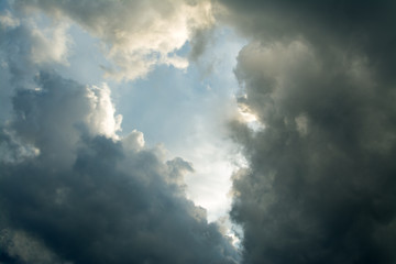 Heart-shaped cloud on a blue and dark sky.
