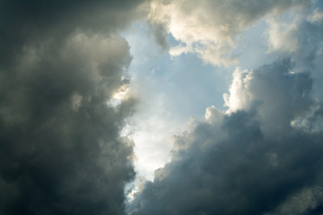 Fototapeta na wymiar Heart-shaped cloud on a blue and dark sky.