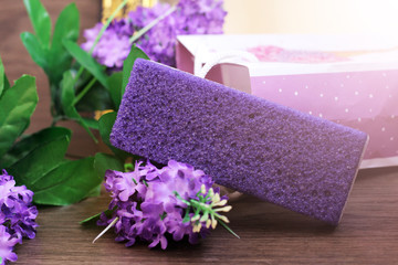 Obraz na płótnie Canvas Purple beautiful pumice and flowers, self-care