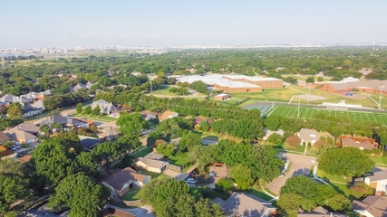 Fototapeta na wymiar Aerial view residential neighborhood in school district with football field in near Dallas, Texas, USA