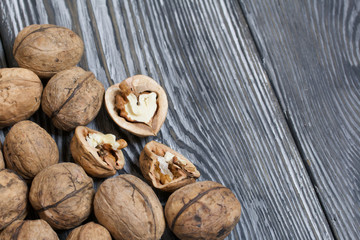 Walnuts. Scattered on painted pine board surfaces.