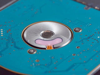 2.5 inch hard disk drive for laptop or computer on a dark paper background. close up, selective...