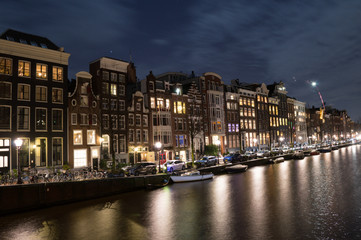 Fototapeta premium Traditional Dutch Canal Houses during New Year’s Eve in Amsterdam, Netherlands