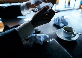 Fototapeta na wymiar Cafe papers on the table crumpled paper coffee cup executive businesswoman lifestyle