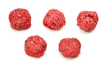Raw meat balls isolated on white background.