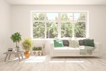 White living room with sofa and summer landscape in window. Scandinavian interior design. 3D illustration