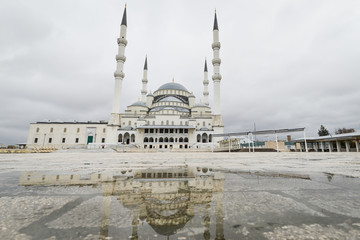 Fototapeta na wymiar Kocatepe Mosque and a reflection over rain pool - Ankara, Turkey