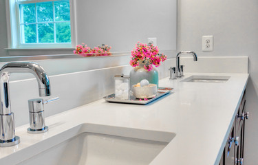 Interior of a modern clean bathroom with white furniture