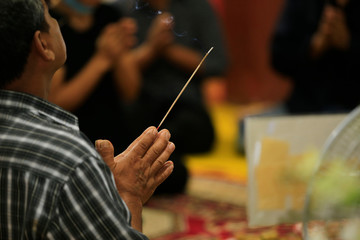 Fototapeta na wymiar buddhist pray with one incense