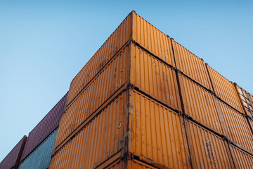 Stacked cargo containers in storage area of freight sea port terminal