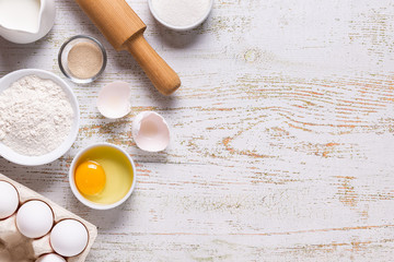 Fototapeta na wymiar Ingredients for baking - flour, eggs, salt, sugar, milk.