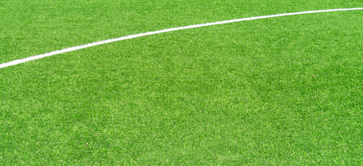 Green artificial grass turf soccer football field background with white lines. Top view - Powered by Adobe