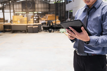 Asian business man writing clipboard on blurred background.metaphor to business in development, success, entrepreneur or employment and advertising logistic image