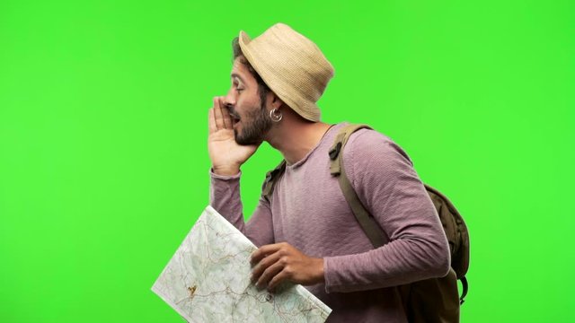 Young traveler man on chroma whispering gossip undertone