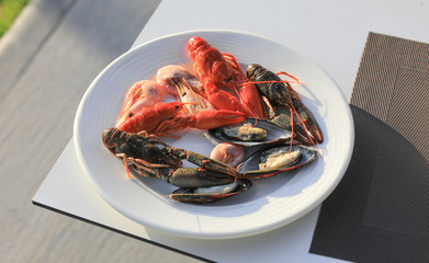 dinner with oysters and shrimps on a plate