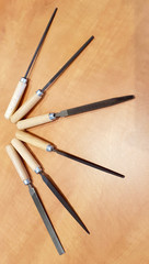 Close up shot of warding file assortment on a wooden table