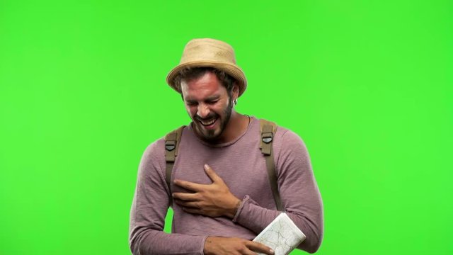 Young traveler man on chroma laughing and having fun