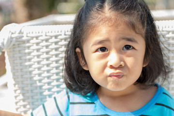 Children girl present her emotional with face. Asian kid love to show feelings.