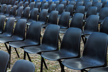 Black chairs in row outside