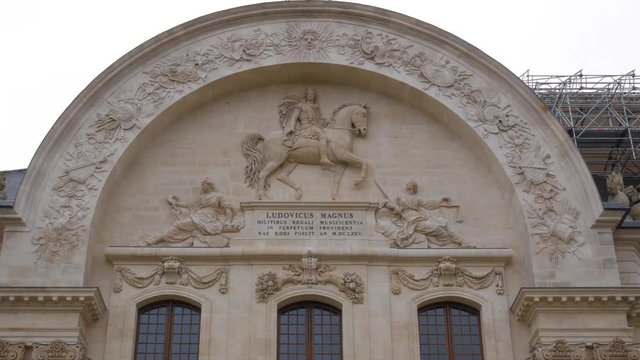Louis XIV On Horseback Carved On The Pediment At The Northern Frontage Of The Les Invalides With A Construction On The Side In Paris, France.  - wide shot