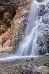 beautiful waterfall next to the river in Ourika valley	