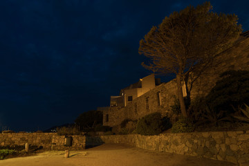 Fototapeta premium Old builing by night in Algajola,Corse