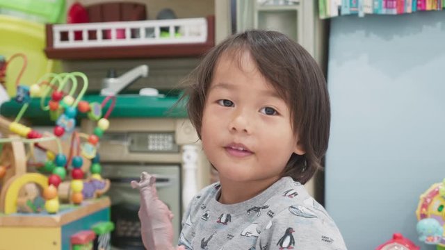 Young boy pulling a series of funny faces on cue.  From Happy, to sad, to angry, to funny, to tired and so on. cute face, adorable.